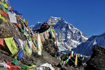 View of the Himalayas and Tibetan prayer flags from Gokyo Ri, Khumbu, Nepal.