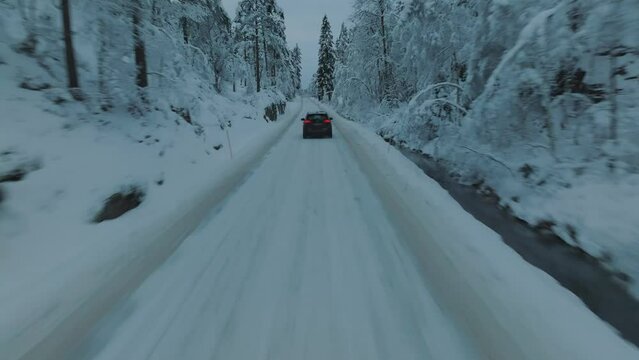EV Opel Ampera driving in beautiful snowy landscape in Norway