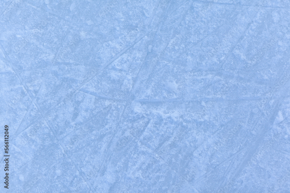 Poster empty ice rink with skate marks after the session outdoor. skating ice rink texture covered with sno