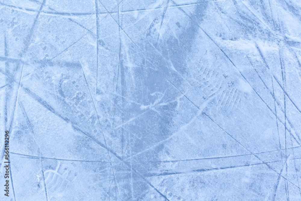 Poster empty ice rink with skate marks after the session outdoor. skating ice rink texture covered with sno