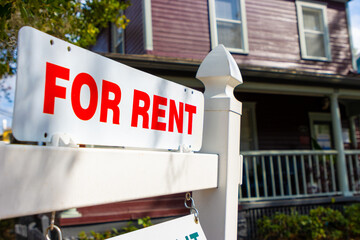 Rent sign in front of home