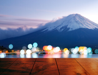 Empty mahogany red wood table and blur background of Fuji mountain landmark of japan