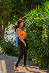 model modeling city phoenix az urban black african american woman women hispanic latina black jeans orange top blue jean jacket editorial fashion beauty beautiful portfolio posing advice arizona 