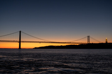 Fototapeta na wymiar 25 de Abril Bridge at sunrise