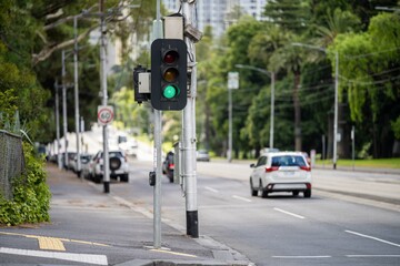 green traffic lights on a street in melbourne australia - obrazy, fototapety, plakaty