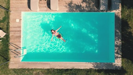 Millennial fit athlete woman making yoga stretching exercises in open air tropical yard on villa Thailand Resort vacation getaway Health care, mental health, wellbeing through meditation