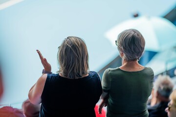 tennis fan watching a tennis match at the australian open eating food and drinking