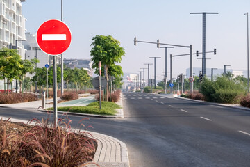 View of an empty beautiful street highway with entry prohibited traffic sign in the city