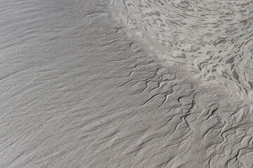 wave sculpted ripple design in the sand