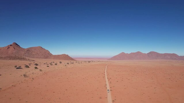 Epic drone footage in 4k of a 4x4 driving through the Namibian Desert, Tiras mountains, Southern Namibia.