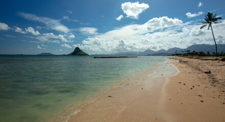 Mokolii island also known as Chinamans Hat as seen from Kualoa Regional Park on the North Shore of Oahu Hawaii United States