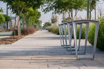Parking for bicycles in the park, bike parking space with racks in the city