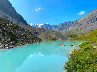 Mountain lake calm turquoise with clear water Karakabak in the Altai mountains.