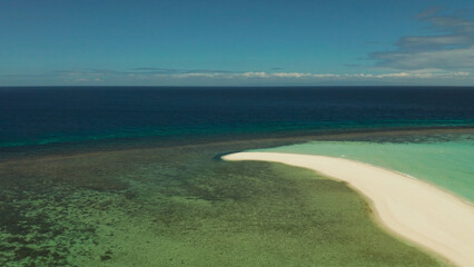Obraz premium Beautiful beach on tropical island surrounded by coral reef, sandy bar, top view. Sandbar Atoll. Summer and travel vacation concept, Camiguin, Philippines.