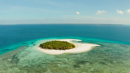 Tropical island with beautiful beach, palm trees and turquoise water view from above. Patawan island with sandy beach. Summer and travel vacation concept.