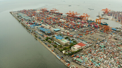 Aerial view of Sea port with container terminal in the city of Manila. Largest cargo port. modern...