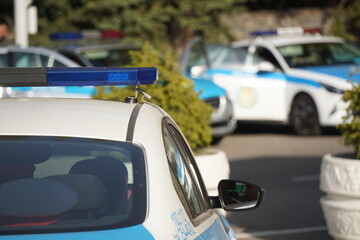 Almaty, Kazakhstan - 09.16.2022 : A Kazakh police car with flashing beacons is on patrol in a public place.