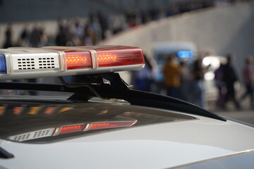 Obraz premium Almaty, Kazakhstan - 09.16.2022 : A Kazakh police car with flashing beacons is on patrol in a public place.
