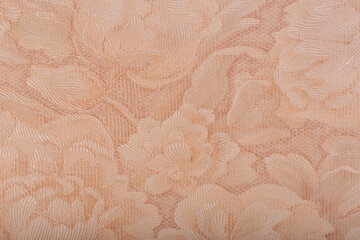 Light background with floral patterns. Textured wallpaper on the wall.