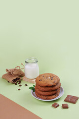 chocolate cookies or snacks with milk chocolate ingredients in a photo with a full color minimalist concept