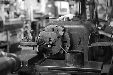 Sheet Metal Stamping Tool Die for Automotive Precision Parts on The Numerical Control Milling Machine Table. Tandem Stamping System. At a High Quality Technology Factory. Black and White Photography.