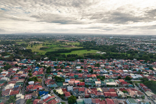 Aerial of BF Resort Las Pinas and a plot of private undeveloped land in Bacoor, Cavite.