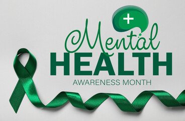 Green ribbon and text MENTAL HEALTH AWARENESS MONTH on light background - obrazy, fototapety, plakaty