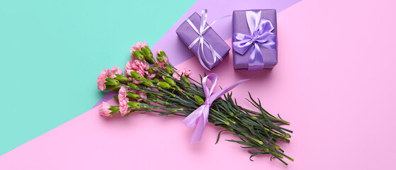 Bouquet of beautiful carnation flowers and gifts for Women's Day on color background
