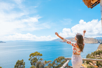 joyful latin woman on vacation and enjoying the sun in a hotel on the sun island in lake titicaca