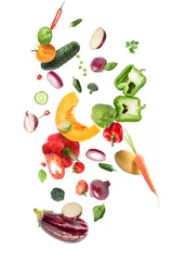 Gordijnen Flying healthy vegetables on white background © Pixel-Shot