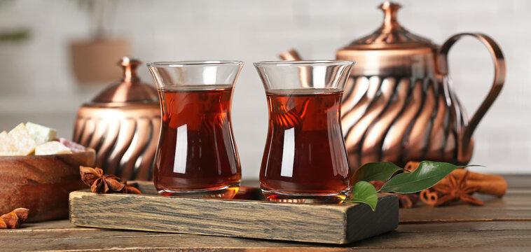 Cups of Turkish tea on wooden table