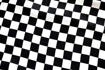 Blurred defocused black and white square and rhombus fabric pattern