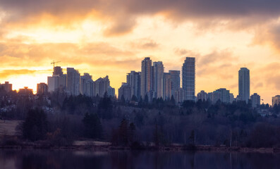 Fototapeta premium Residential apartments highrises in Metrotown Area. Taken in Deer Lake, Burnaby, Vancouver, BC, Canada. Sunset