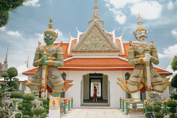 tourist at the gate of wat arun temple in bangkok, thailand
