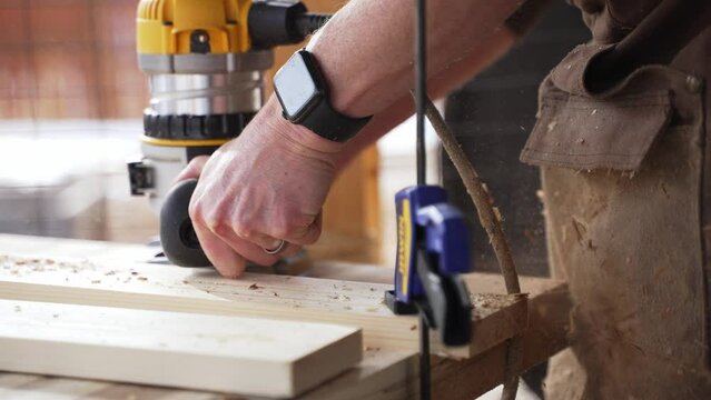 Carpenter using a Buzzsaw on Slabs of Wood. Wearing an Apple Watch. Daytime. 120 FPS.