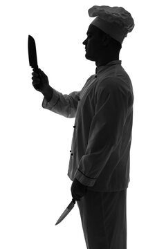 Silhouette of male chef with knives on white background