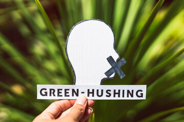 green-hushing companies staying silent about their environmental impact, text and face with mouth...
