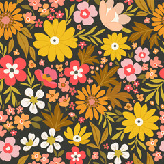 Floral pattern of large yellow, red and orange flowers on a dark background. Rustic chic.