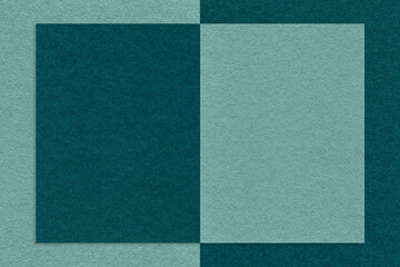 Fototapeta premium Texture of emerald and cyan paper background with geometric shape and pattern, macro. Structure of craft teal cardboard