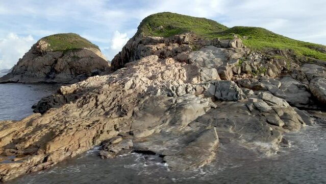 Drone above sea and rock formations. Islands and rocky landscape. Hong Kong coastline. Cape D'Aguilar. Asia