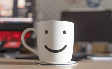 White coffee cup have a working area for business background.