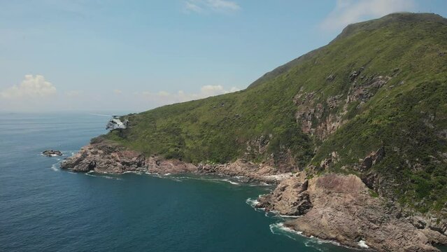 Aerial view of the helicopter hovering over water at Tung Lung Island