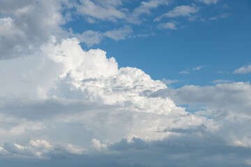 Fototapeta na wymiar Cumulus Nimbus storm clouds with a blue sky.