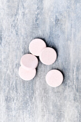 Collagen effervescent Tablets. Supplement to support collagen production. Bright wooden background. Soft focus. Top view. Close up. Copy space. 