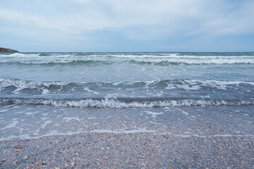 Waves on the sea during sunset. Relaxation, enjoyment. Journey to the ocean, peace and happiness. High quality 4k footage.