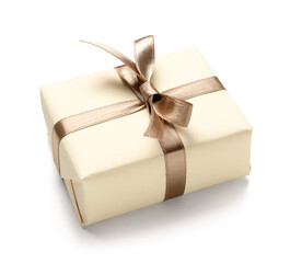 Gift box tied with silk ribbon on white background