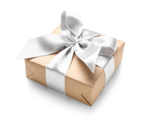 Gift box wrapped in craft paper with silk ribbon on white background