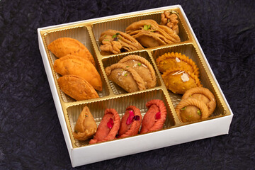 Variety Of Traditional Indian Mithai Gujiya Also Called Gujia, Ghughra, Karanji, Somas, Garijalu, Kajjikayalu, Karigadubu, Gunjiya, Pedakiya, Karjikayi Stuffed With Khoya, Mawa, Malai, Mishri