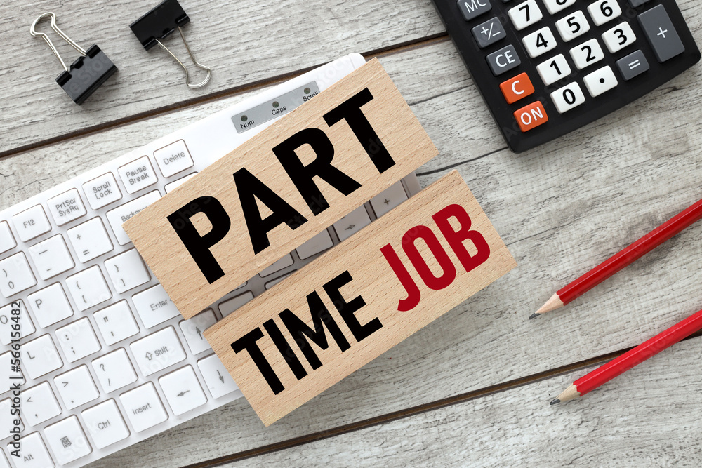 Poster part-time job two wooden blocks with text on a white keyboard.