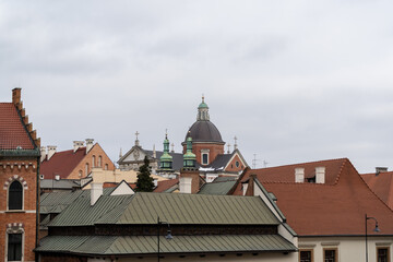 Rooftops of the Old Town district of Kraków city. Cityscape with Saints Peter and Paul Church in...